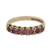 A ruby seven stone ring 9ct yellow gold