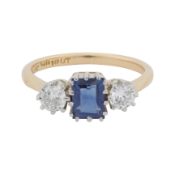 A sapphire and diamond three stone ring Yellow and white metal