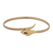 A garnet snake bangle 9ct yellow gold