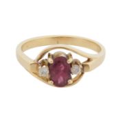 A ruby and diamond three stone ring Yellow metal