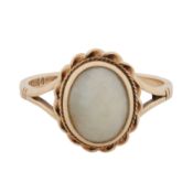 A white jadeite single stone ring 9ct yellow gold