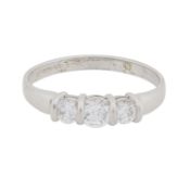 A three-stone diamond simulant ring 9 carat white gold