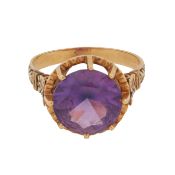 A synthetic purple sapphire single stone ring Yellow metal