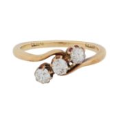 A three stone diamond ring Yellow metal