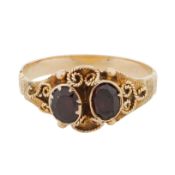 A garnet two stone ring Yellow metal