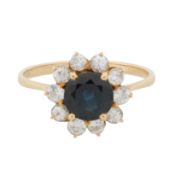 A sapphire and white paste halo ring Yellow metal