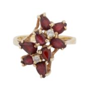 A garnet and diamond ring Yellow metal