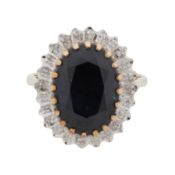 A sapphire and diamond halo ring 9ct yellow and white gold