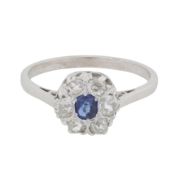 A sapphire and diamond halo ring White metal