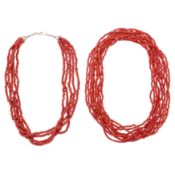 A red coral necklace and strands White metal