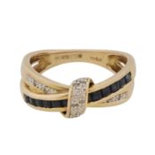 A sapphire and diamond crossover ring 9ct yellow gold