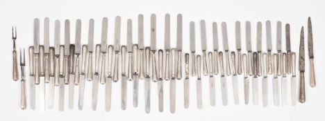 A large quantity of silver-handled knives