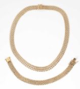 An Italian bi-colour 18k gold necklace and bracelet