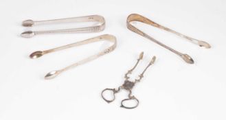 Three pairs of George III silver sugar tongs