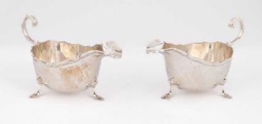 A near pair of silver sauce boats