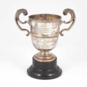 A two-handled silver trophy cup