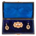 A Victorian yellow metal brooch and earrings