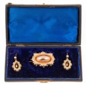 A Victorian yellow metal brooch and earrings