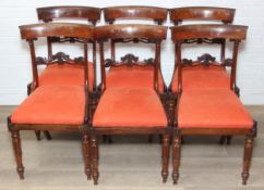 Set of six regency period mahogany dining chairs with carved backs & later orange upholstered seats,