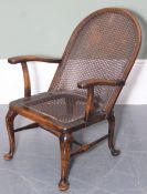 A vintage armchair with bergere seat and back, early 20th century, 60cm wide x 84cm tall