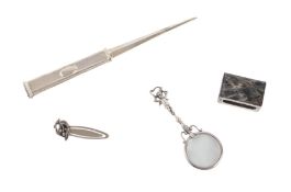 A hardstone mounted silver matchbox cover, a continental silver chatelaine magnifying glass with