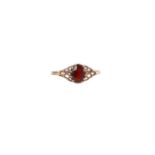 A 9ct gold garnet set dress ring, approx UK size X, 1.7g.
