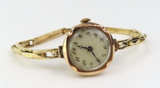 A 9ct gold mechanical midsize bracelet watch, the