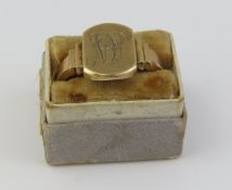 A 9ct gold rectangular head signet ring, with step