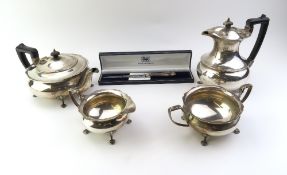 A tea set of silver plate and a silver letter opener