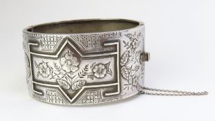 A wide silver bangle