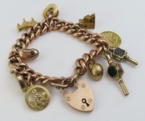 A 9ct rose gold curb link bracelet with a padlock