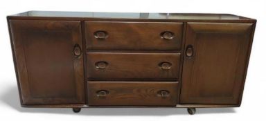 An Ercol Windsor mid-20th century dark wooden sideboard
