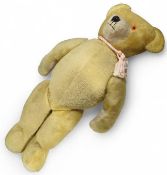 A large articulated teddy bear, with jointed arms