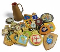 A collection of ship and heraldic crests, and plaq