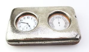 A wooden watch console with silver frame