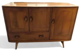 An Ercol Windsor mid-20th century short wooden sideboard,