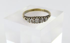 A five stone diamond ring, marked ‘18ct’, the grad