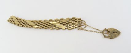 A 9ct gold brick link bracelet, with padlock clasp