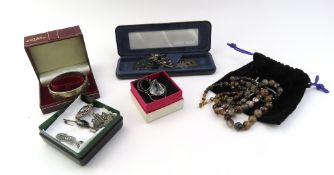 A wide silver bangle and other items