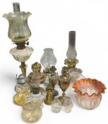 A 19th century oil lamp with a marbled glass reser