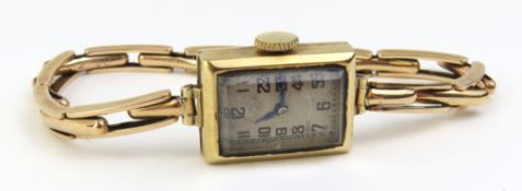 A 9ct gold ladies bracelet watch on a spring link