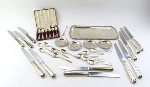 A collection of silver and white metal