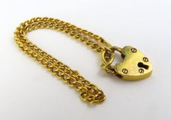 A 9ct gold, child’s bracelet, with a gold padlock