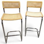 A pair of cantilever bar stools in the manner of M