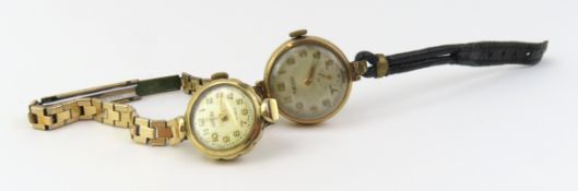 A pair of 9ct gold ladies mechanical bracelet watc