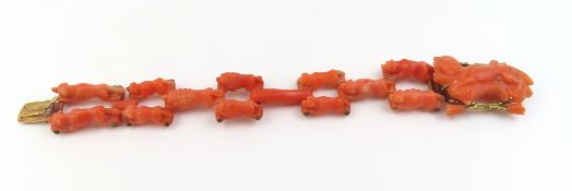 A finely carved coral bracelet, comprising various