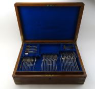 An oak canteen with brass bindings and handles