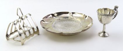 A silver dish in the shape of a flower,