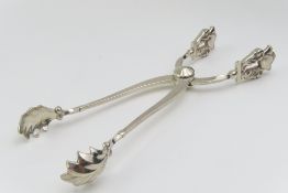A pair of mid-20th century silver ice tongs
