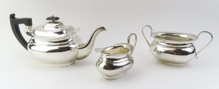A silver tea set comprising a round